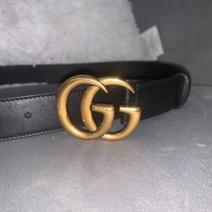 Black and gold gucci belt